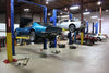 Corvette garage filled with Corvettes being repaired